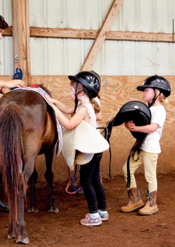 Children learning to ride at Peachtree Farms in Arrington, Tennessee